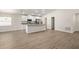 Spacious open-concept floor plan with a modern kitchen and dining area at 2614 58Th E Cir, Palmetto, FL 34221