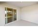 Covered outdoor patio with sliding glass doors to the interior at 2614 58Th E Cir, Palmetto, FL 34221