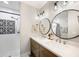 Clean bathroom, featuring a double vanity and a walk-in shower at 1413 Sandalwood Dr, Plant City, FL 33563