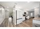 Modern kitchen with white cabinets, granite countertops, and stainless steel appliances at 1413 Sandalwood Dr, Plant City, FL 33563