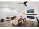 Modern living room with a white shiplap wall and electric fireplace at 1413 Sandalwood Dr, Plant City, FL 33563