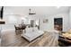 Open concept living and dining area with modern decor and a fireplace at 1413 Sandalwood Dr, Plant City, FL 33563