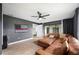 Spacious living area with a comfortable sectional sofa and large TV at 1413 Sandalwood Dr, Plant City, FL 33563