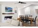 Bright and airy living room with a large TV and dining area at 1413 Sandalwood Dr, Plant City, FL 33563