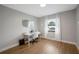 Bright office space with wood floors and a large window at 1413 Sandalwood Dr, Plant City, FL 33563