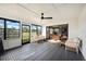 Bright and airy sunroom with comfy seating and ceiling fan at 1413 Sandalwood Dr, Plant City, FL 33563