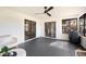 Cozy screened porch with grey tile flooring, perfect for relaxing at 1413 Sandalwood Dr, Plant City, FL 33563