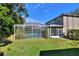 Expansive backyard with a screened pool and patio at 3507 Autumn Glen Dr, Valrico, FL 33596