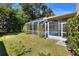Landscaped backyard featuring a screened-in pool at 3507 Autumn Glen Dr, Valrico, FL 33596