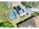 Aerial view of a home with solar panels, screened pool, and backyard at 3507 Autumn Glen Dr, Valrico, FL 33596
