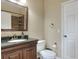 Well-appointed bathroom with dark vanity and shower at 3507 Autumn Glen Dr, Valrico, FL 33596