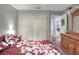 Bright bedroom with a queen bed and built-in wooden dresser at 3507 Autumn Glen Dr, Valrico, FL 33596