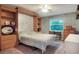 Bedroom with a built-in murphy bed and ample shelving at 3507 Autumn Glen Dr, Valrico, FL 33596