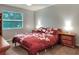 Cozy bedroom with a queen bed and wood nightstands at 3507 Autumn Glen Dr, Valrico, FL 33596