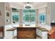 Kitchen breakfast nook with built-in seating and pool view at 3507 Autumn Glen Dr, Valrico, FL 33596