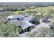 Aerial view of community clubhouse with grey roof and landscaped grounds at 3507 Autumn Glen Dr, Valrico, FL 33596