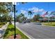 Gated community entrance with flag and landscaping at 3507 Autumn Glen Dr, Valrico, FL 33596