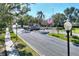 Gated entrance to a community with palm trees and landscaping at 3507 Autumn Glen Dr, Valrico, FL 33596