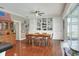 Dining room with built-in shelving and hardwood floors at 3507 Autumn Glen Dr, Valrico, FL 33596