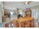Bright dining room with wooden table and access to the kitchen at 3507 Autumn Glen Dr, Valrico, FL 33596