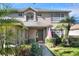 Two story house with dark front door and lush landscaping at 3507 Autumn Glen Dr, Valrico, FL 33596