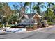Gated community entrance with guard house and landscaping at 3507 Autumn Glen Dr, Valrico, FL 33596