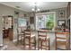 Charming home bar with seating and a view of the backyard at 3507 Autumn Glen Dr, Valrico, FL 33596