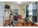 Home office with exercise equipment, built-in desk, and whiteboard at 3507 Autumn Glen Dr, Valrico, FL 33596