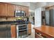 Kitchen with stainless steel appliances and granite countertops at 3507 Autumn Glen Dr, Valrico, FL 33596