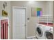 Laundry room with washer, dryer, and shelving at 3507 Autumn Glen Dr, Valrico, FL 33596