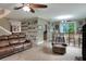 Spacious living room with leather furniture and built-in shelving at 3507 Autumn Glen Dr, Valrico, FL 33596