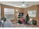Home office with a standing desk, ergonomic chair, and ample storage at 3507 Autumn Glen Dr, Valrico, FL 33596
