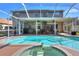 Inviting pool and spa area with screened enclosure at 3507 Autumn Glen Dr, Valrico, FL 33596