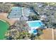 Community lap pool and leisure pool with surrounding trees at 3507 Autumn Glen Dr, Valrico, FL 33596