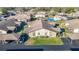 Aerial view of condo building with carport and landscaping at 4531 Blossom Blvd # 4531, Zephyrhills, FL 33542