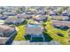 Community overview showing homes, pool, and clubhouse at 4531 Blossom Blvd # 4531, Zephyrhills, FL 33542
