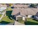 House with a screened patio and surrounding landscape, seen from above at 4531 Blossom Blvd # 4531, Zephyrhills, FL 33542