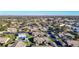 Aerial view showing homes, pool, and surrounding landscape at 4531 Blossom Blvd # 4531, Zephyrhills, FL 33542