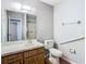 Main bathroom with toilet, vanity, and mirror at 4531 Blossom Blvd # 4531, Zephyrhills, FL 33542