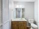 Bathroom with toilet, vanity, and mirror at 4531 Blossom Blvd # 4531, Zephyrhills, FL 33542