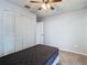 Bedroom with double closet and ceiling fan at 4531 Blossom Blvd # 4531, Zephyrhills, FL 33542
