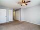 Primary bedroom with ceiling fan and built-in closet at 4531 Blossom Blvd # 4531, Zephyrhills, FL 33542