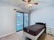 Bright bedroom with a single bed and sliding glass doors leading to a patio at 4531 Blossom Blvd # 4531, Zephyrhills, FL 33542