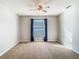 Spacious bedroom with neutral walls and ceiling fan at 4531 Blossom Blvd # 4531, Zephyrhills, FL 33542