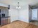 Dining area with wood flooring and a chandelier at 4531 Blossom Blvd # 4531, Zephyrhills, FL 33542