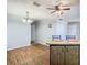 Simple dining area with wood floor and kitchen access at 4531 Blossom Blvd # 4531, Zephyrhills, FL 33542