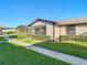 Single-story home with a covered patio and well-manicured landscaping at 4531 Blossom Blvd # 4531, Zephyrhills, FL 33542