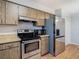 Kitchen with stainless steel appliances and wood cabinets at 4531 Blossom Blvd # 4531, Zephyrhills, FL 33542