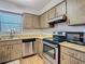 Stainless steel appliances in this updated kitchen at 4531 Blossom Blvd # 4531, Zephyrhills, FL 33542