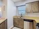 Kitchen with stainless steel dishwasher and sink at 4531 Blossom Blvd # 4531, Zephyrhills, FL 33542